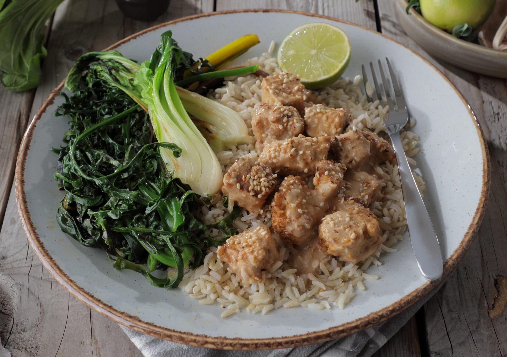 Spicy Tofu Served with a Peanut and Coconut Sauce and Wilted Greens - Vegetarian Society