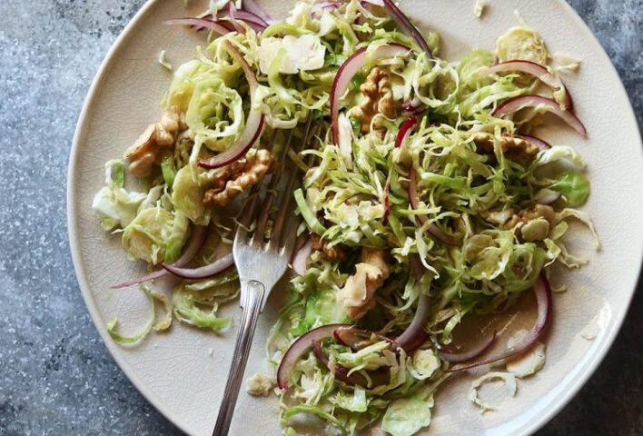 Plate featuring shredded Brussels sprouts and fork
